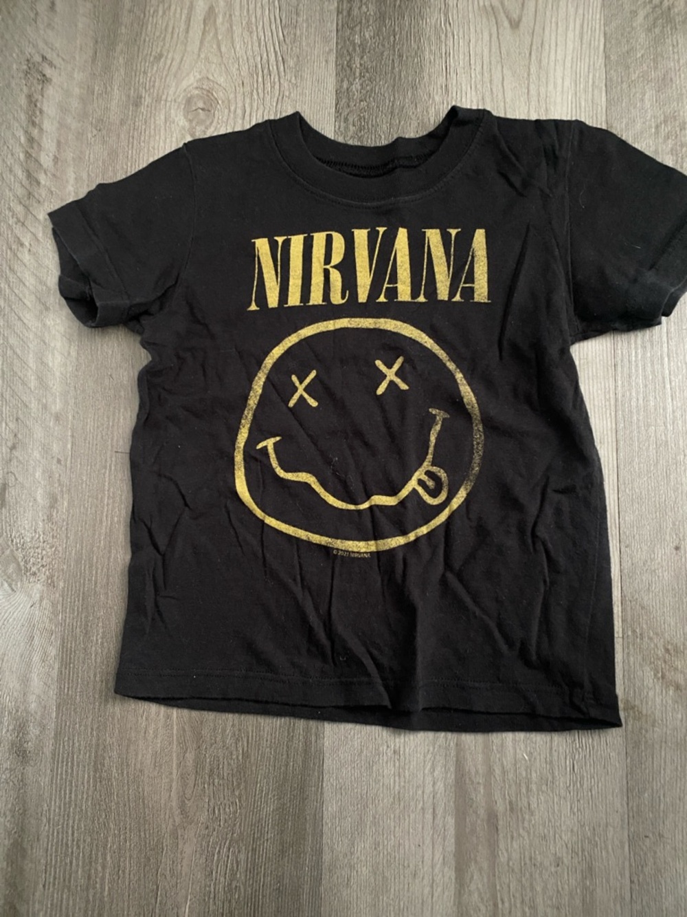 NIRVANA Black Tee with Gold Smiley Logo